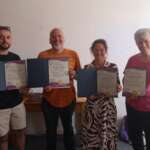 Photo showing 4 previous trainees holding their Foundation Certificates in Hypnotherapy