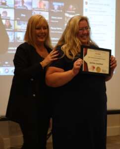 A photo of Katina Chapman being handed an award by Sheila Granger at the Hypnosis Growth Awards